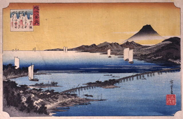 安藤広重作『近江八景 瀬田夕照』。瀬田の唐橋と夕映えの琵琶湖を描き、静寂の中に広がる光のグラデーションが美しい浮世絵。