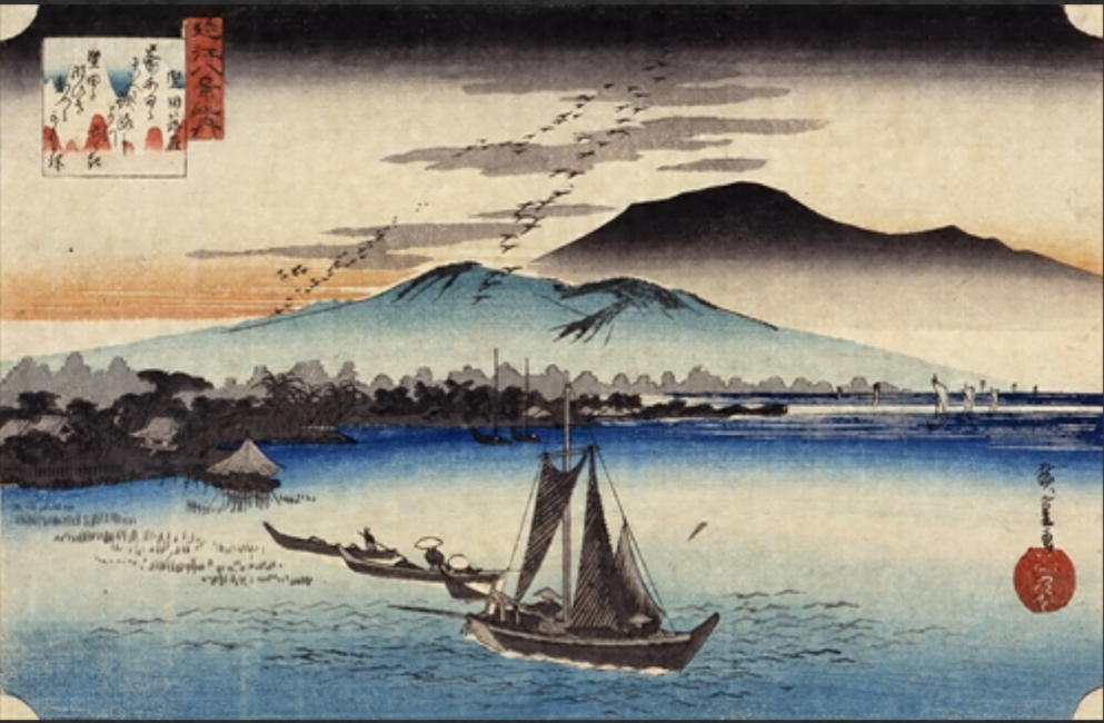 安藤広重作『近江八景 堅田の落雁』。雁が群れをなして飛ぶ秋空と、琵琶湖に浮かぶ舟の情景が静寂な美を醸し出している。